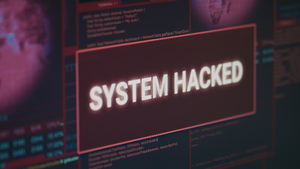 computer-monitor-showing-hacked-system-alert-messa-2023-05-11-20-13-20-utc-1