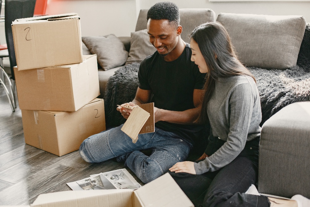 couple-is-sitting-on-a-floor-in-the-living-room-ne-2022-06-08-16-13-18-utc-1