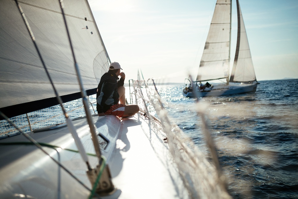young-handsome-man-relaxing-on-his-sailboat-2022-02-08-22-39-26-utc-1